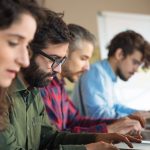 Business owner reviewing offsite data backup services in New Orleans LA with a TechnologyEdge engineer
